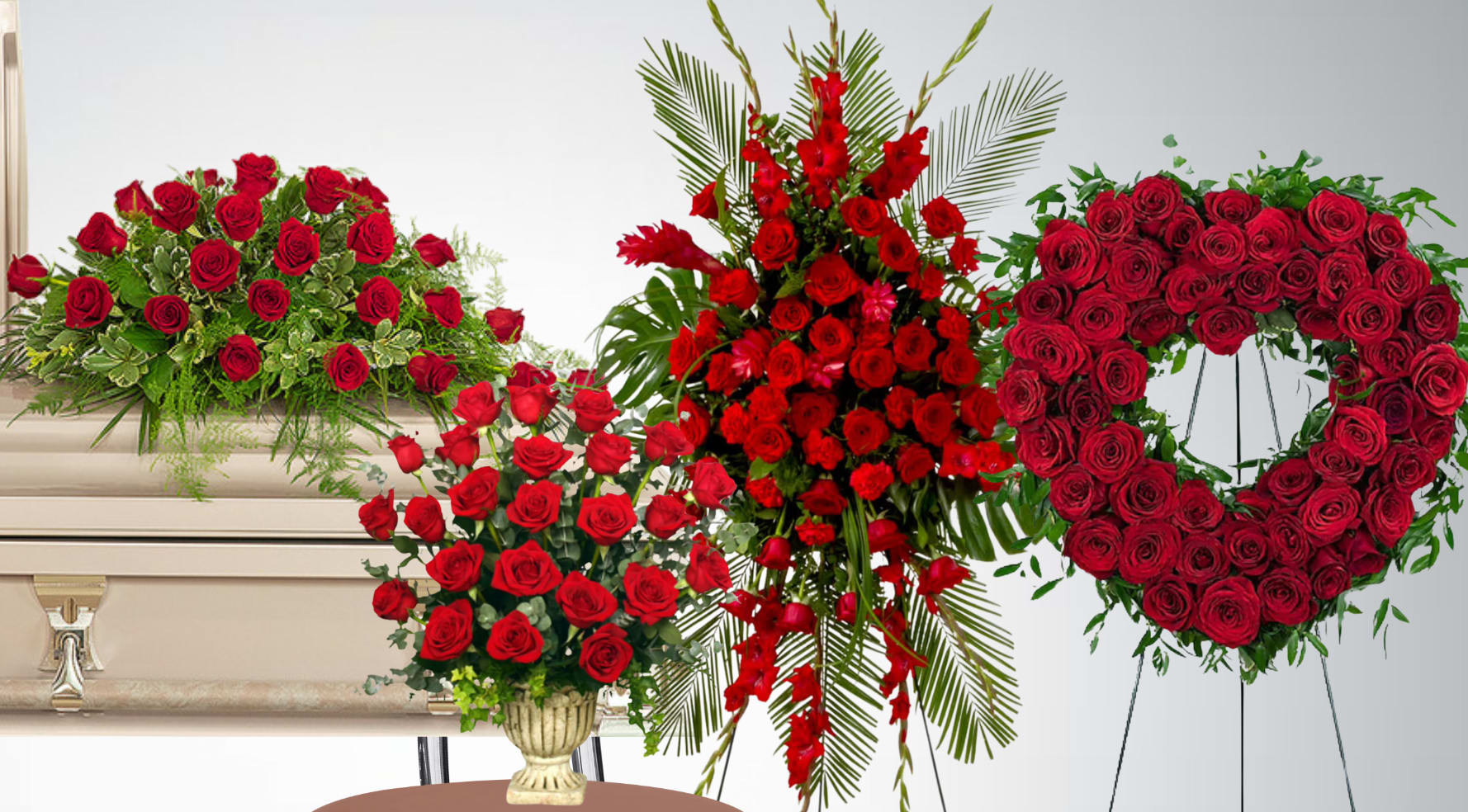 Set of red rose funeral pieces including casket spray, standing spray, vase bouquet, and heart wreath on easels