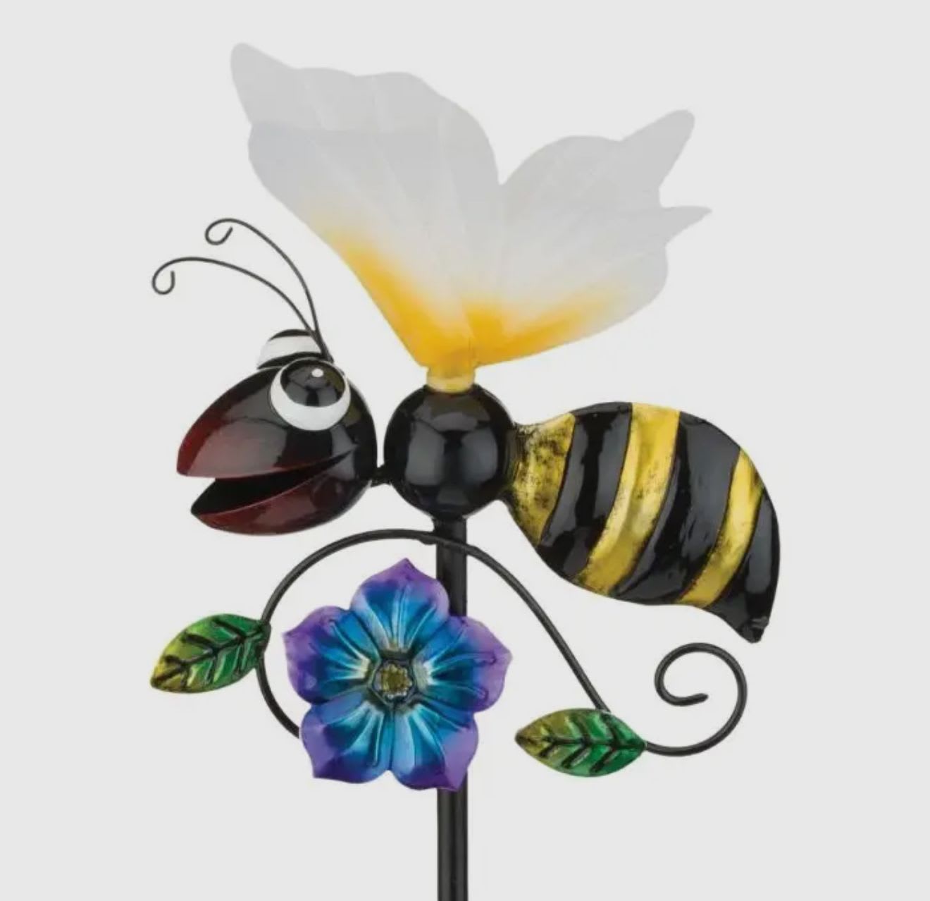 Decorative metal bee with a white flower and blue-purple blossom