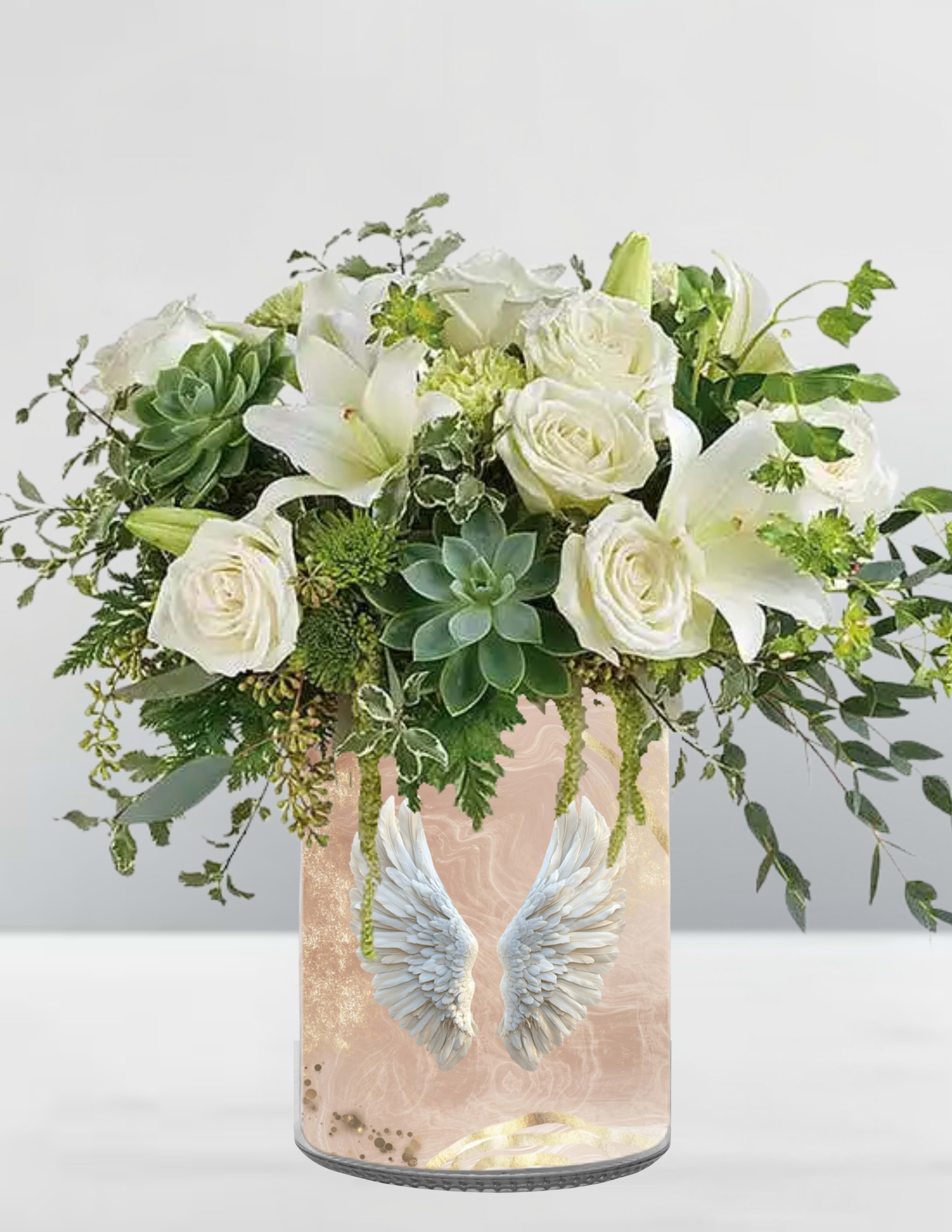 White roses and lilies in a pink vase with angel wings