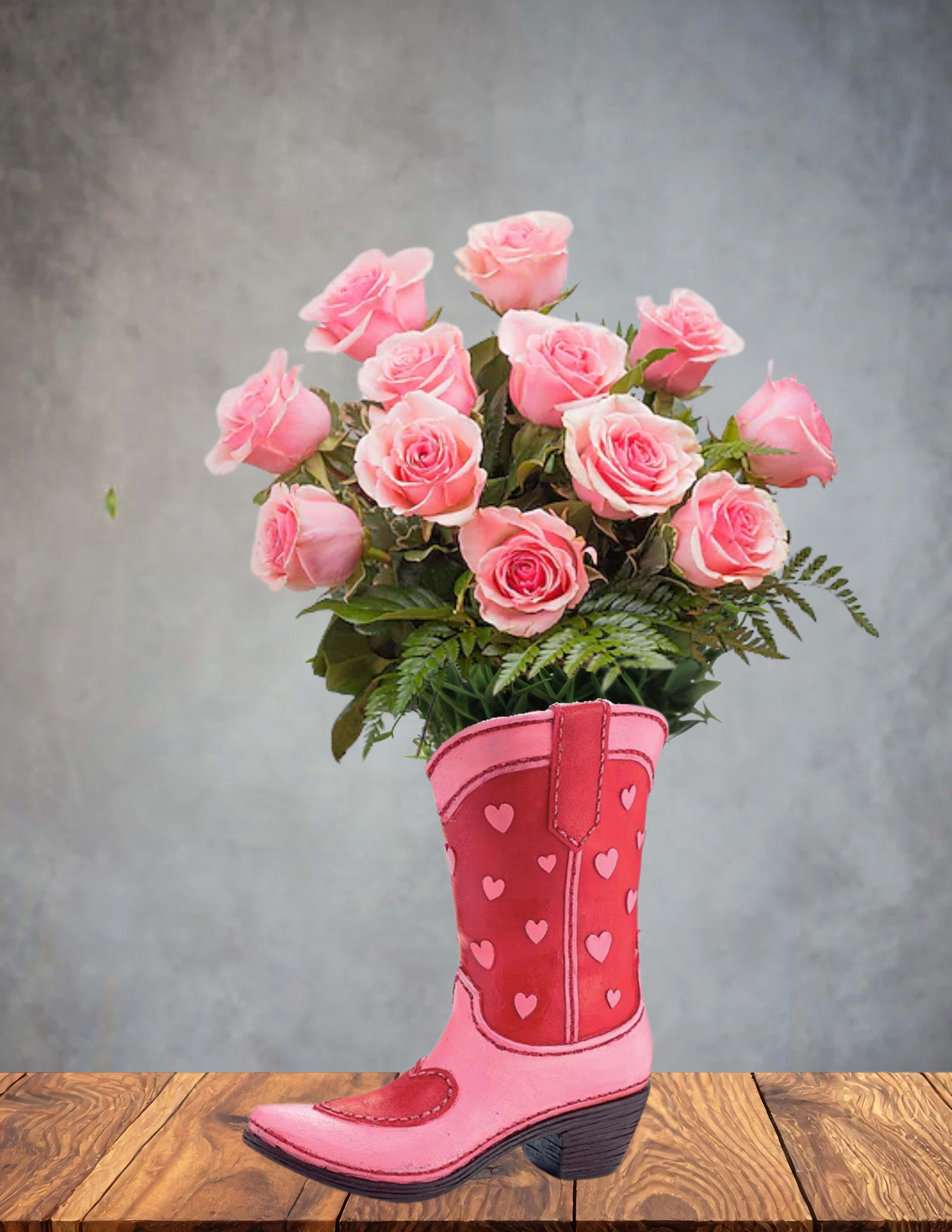 Pink roses arranged in a pink cowboy boot vase