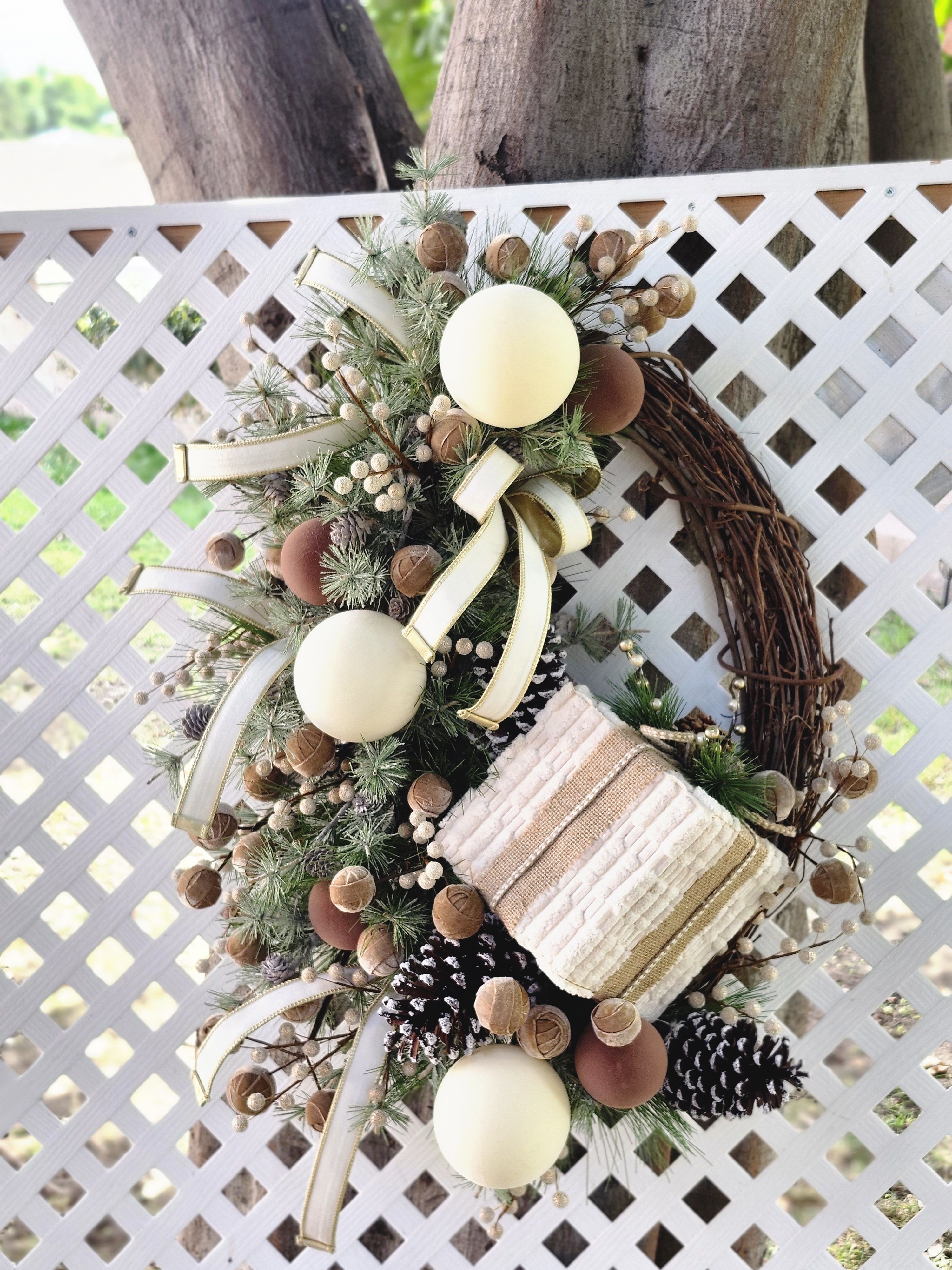 Natural present grapevine wreath  - Oblong grapevine wreath with designer ribbon, soft fabric square present, felt ball ornaments, real pineconesbeaded ball picks and velvet ball picks, Christmas greenery,  lights brown, creamer whites  9" depth, 30" length, 20" wide