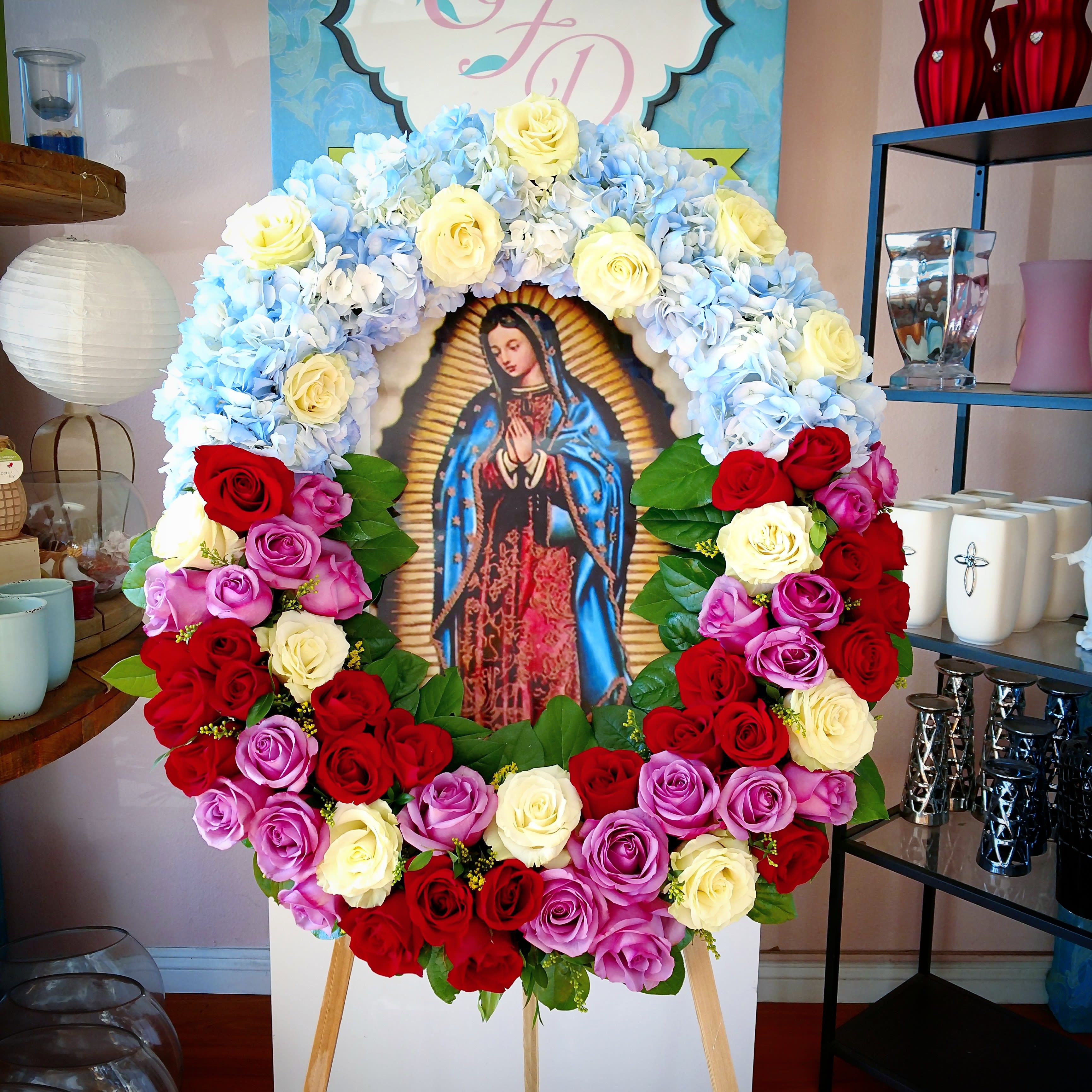 Large floral wreath around an image of the Virgin of Guadalupe