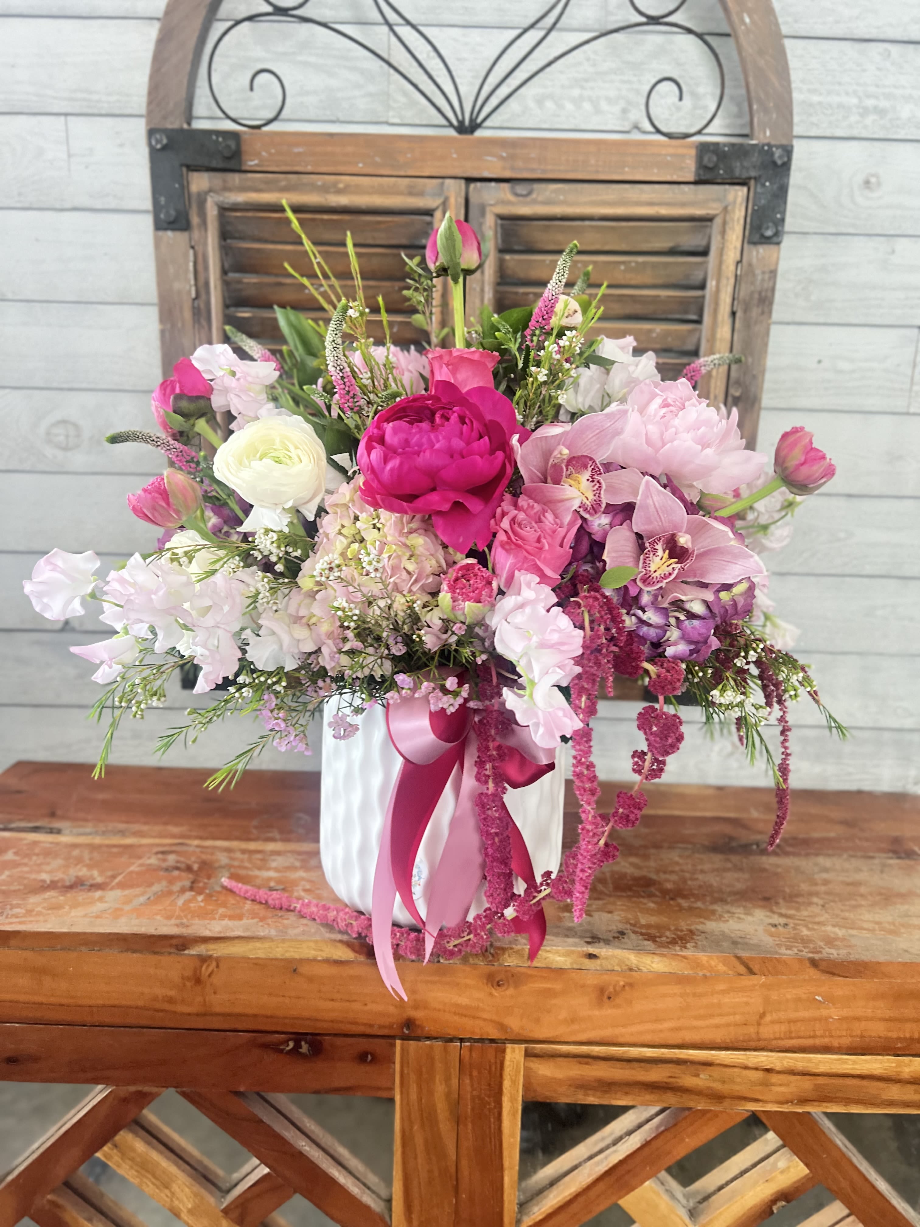 Dolce Amore  - Premium peonies in combination with light pink and hot pink delight flowers.
