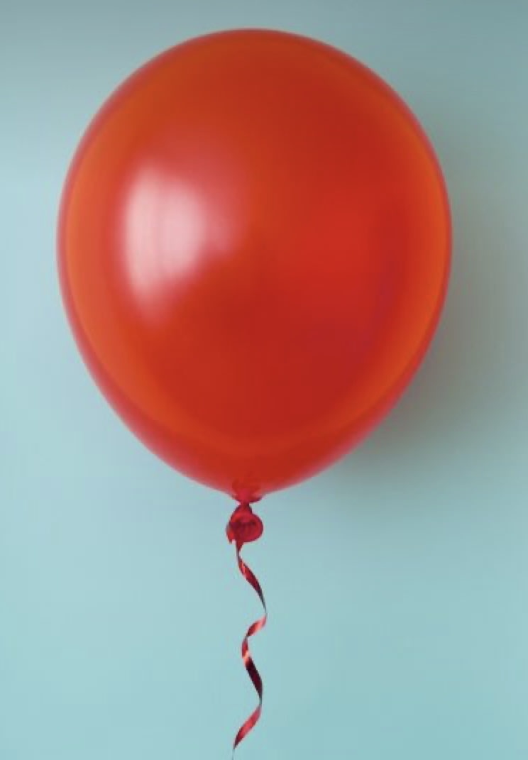Red balloon with a curled ribbon against a light blue background