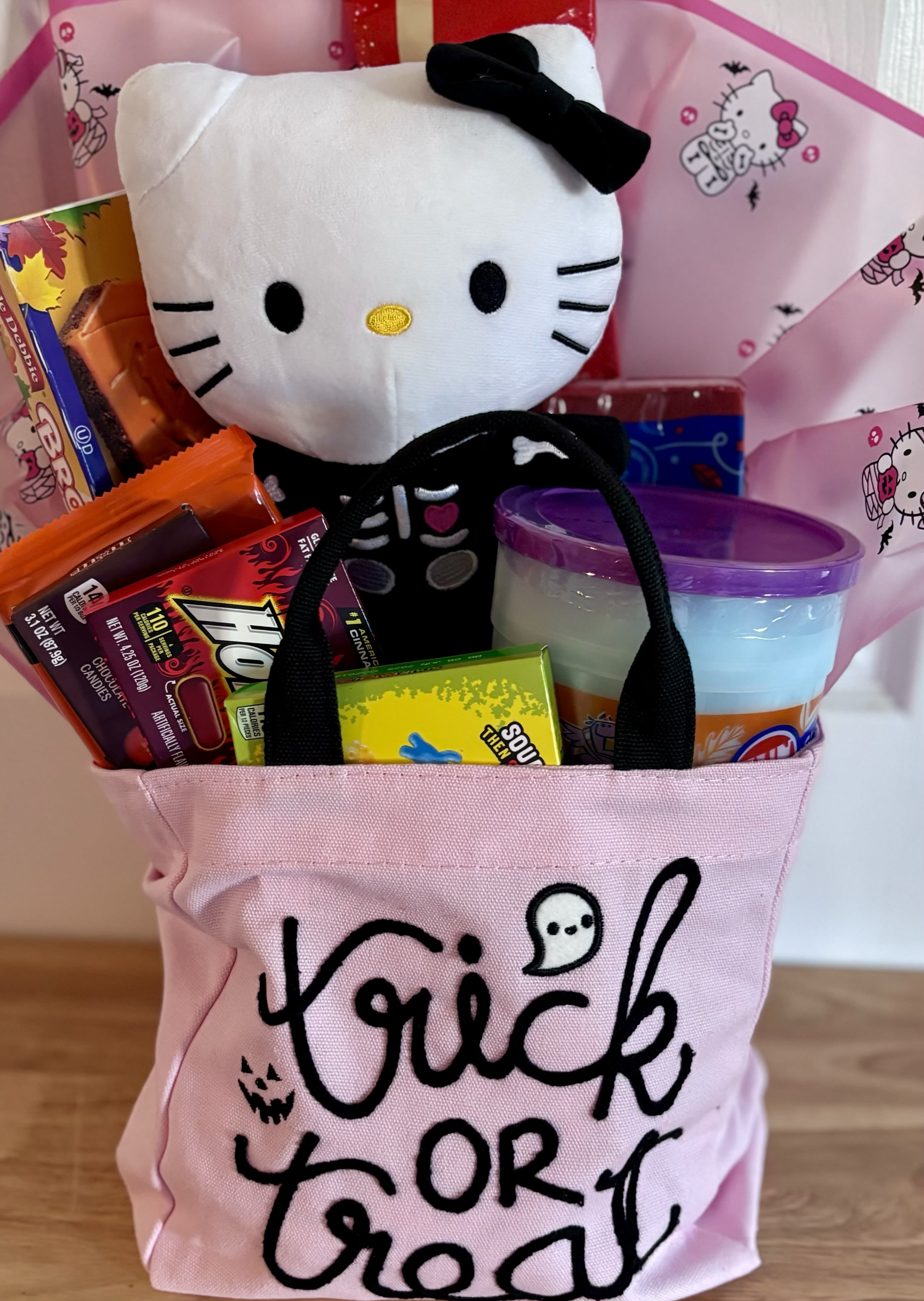 Trick or Treat  - Adorable canvas tote filled with goodies  Hello kitty plushie is not Included but can be purchased separately 