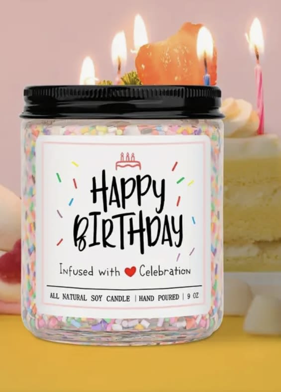Birthday candle in a glass jar with a black lid