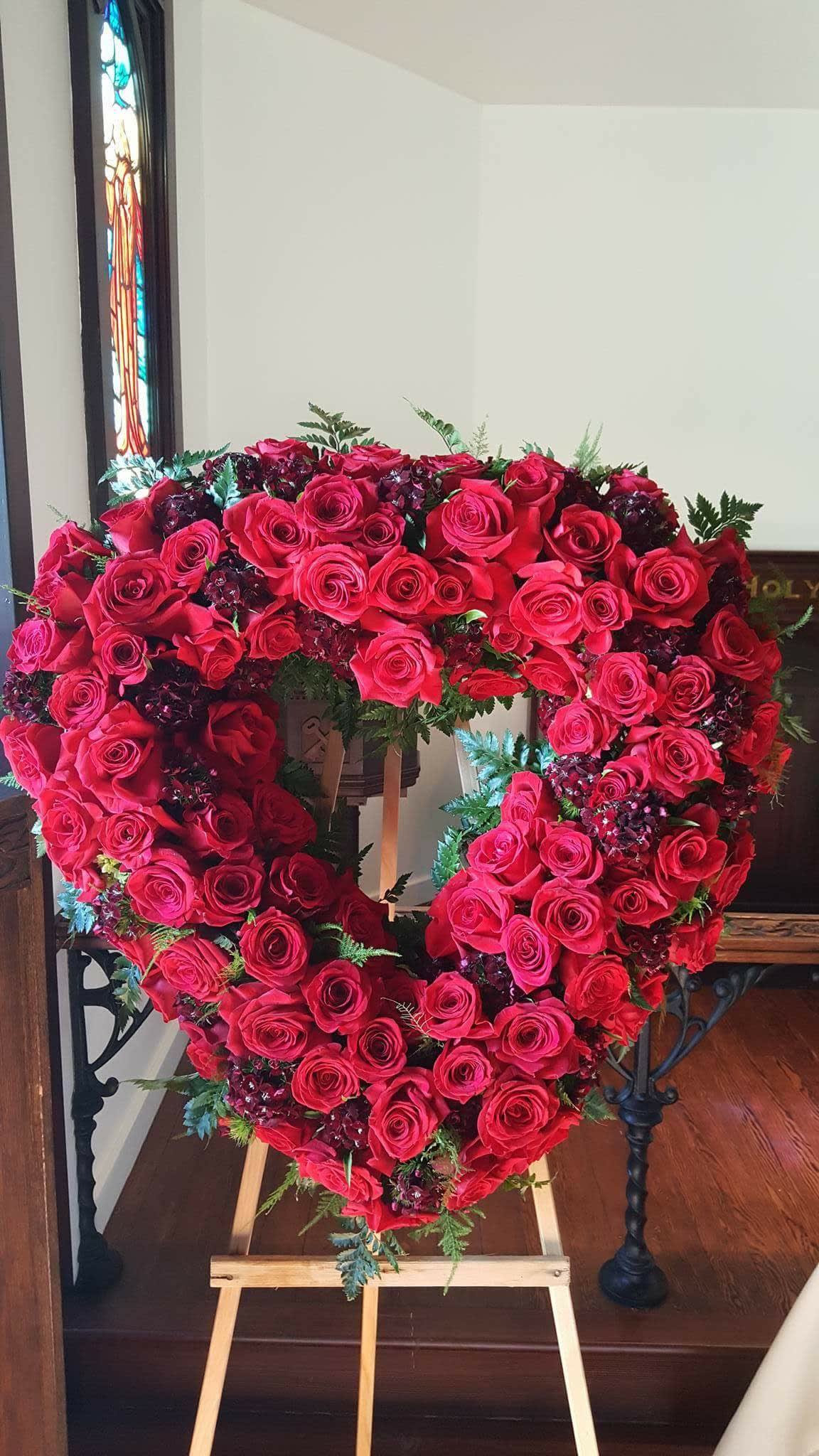 Heart-shaped rose wreath on an easel