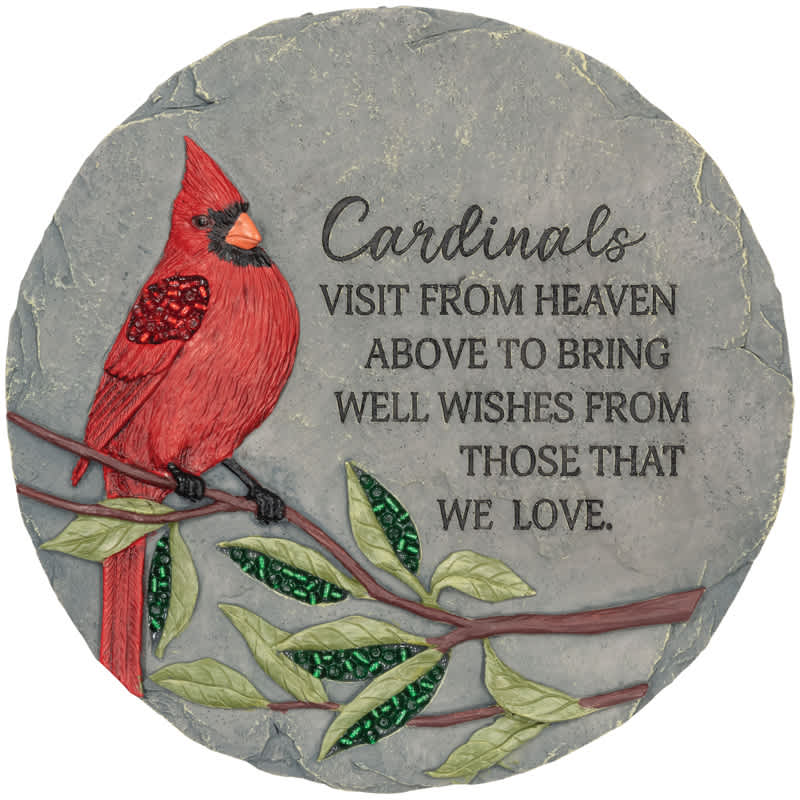 Round stone plaque with a red cardinal and memorial text