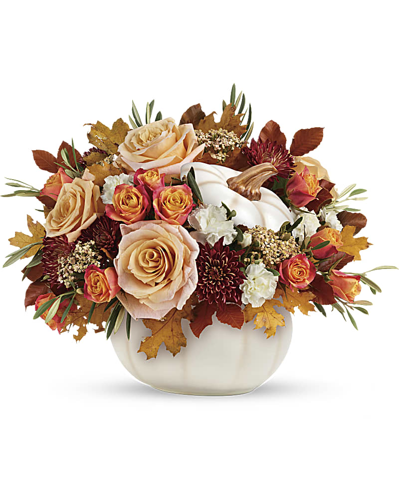 Harvest Charm Bouquet - Elegant crème roses blend with the heartwarming hues of autumn in this charming bouquet, artfully arranged in a white lidded pumpkin bowl, a versatile fall decor favorite! This charming arrangement features crème roses, white miniature carnations, burgundy cushion spray chrysanthemums, yellow cottage yarrow, olive, and brown copper beech. Delivered in an Enchanted Harvest Pumpkin