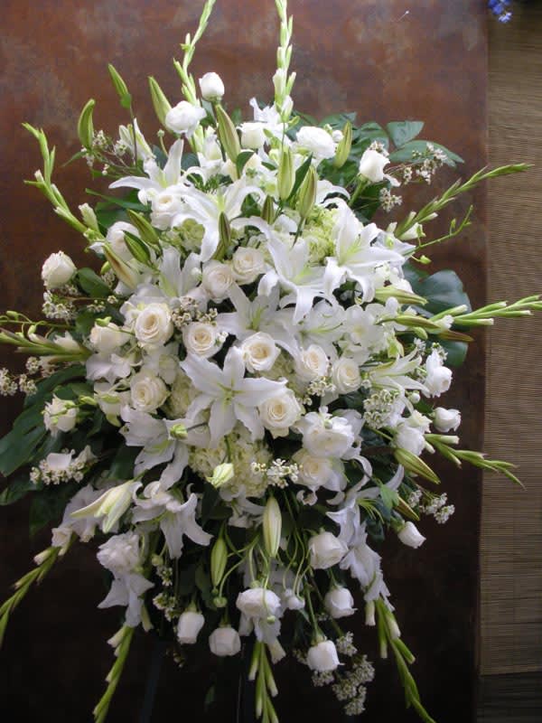 Large white floral spray with lilies and roses