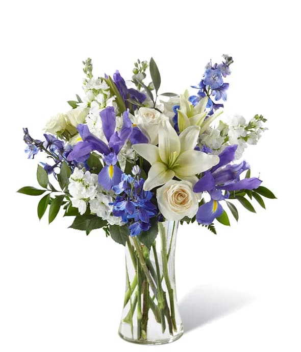 Calming Comfort Bouquet - Our Calming Comfort Bouquet is crafted with iris, lilies, stock and delphinium. This unique mix of blue and white flowers makes a well-suited gift for any occasion.