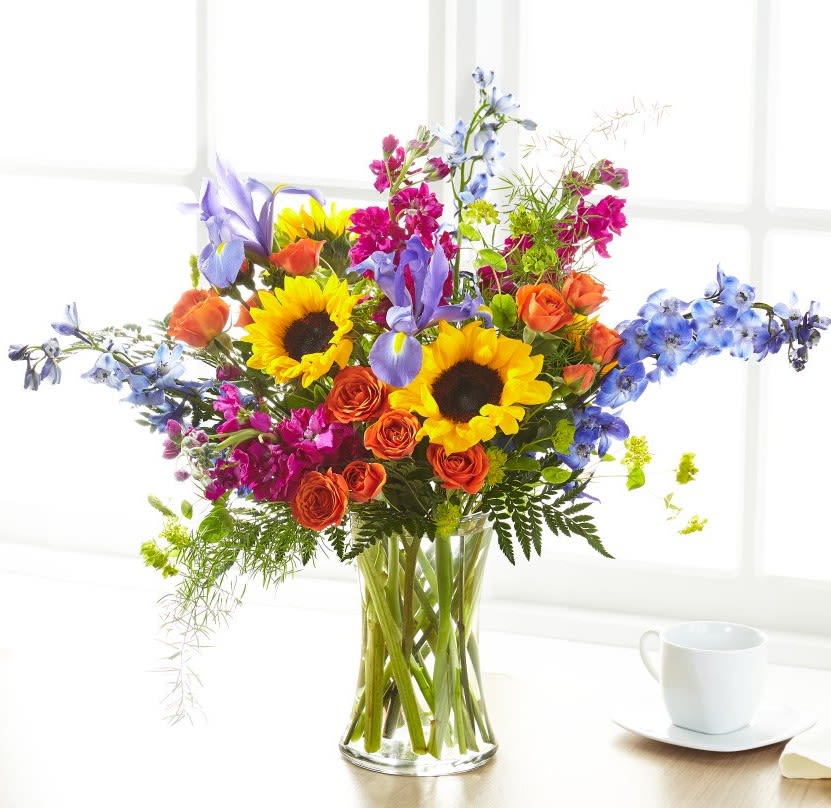 Rays of Life Bouquet - Show your loved ones how much you care about them with a beautiful bouquet full of bright summer florals. Our Rays of Life Bouquet arrives handcrafted with sunflowers, iris, stock and delphinium to offer your comfort.