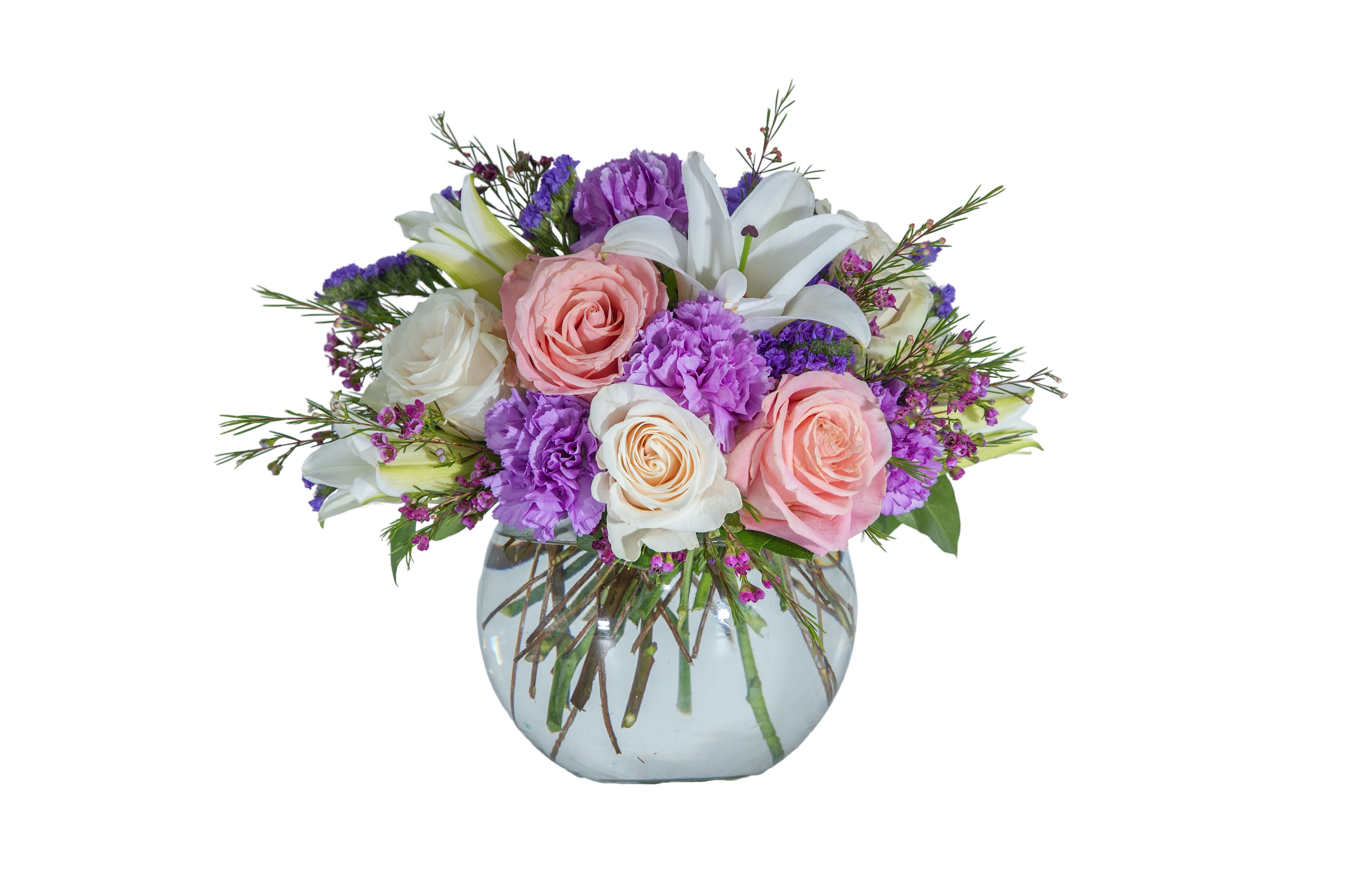 Bouquet of pink and white roses with purple flowers in a glass vase