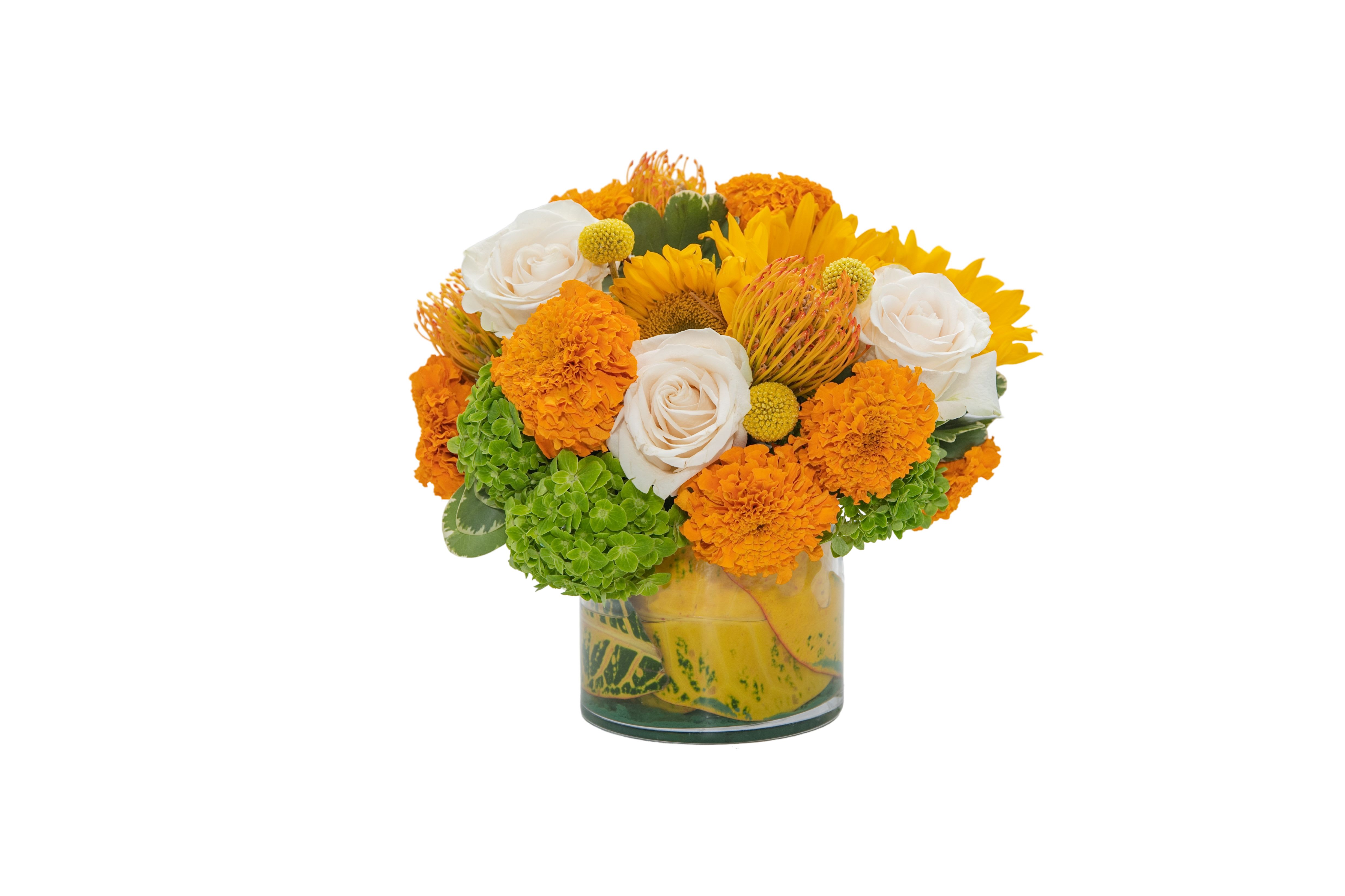 Orange and white flower arrangement in a glass vase