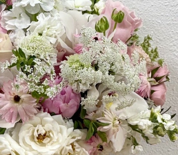 Bouquet of white and pale pink flowers with airy filler blooms
