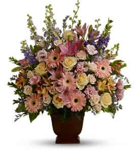  T220-1A Teleflora's Loving Grace - Fresh flowers such as peach and light pink roses, lavender and purple larkspur, pink asiatic lilies, alstroemeria, gerberas and lisianthus are set in an exclusive Noble Heritage urn. Approximately 26 W x 30 H