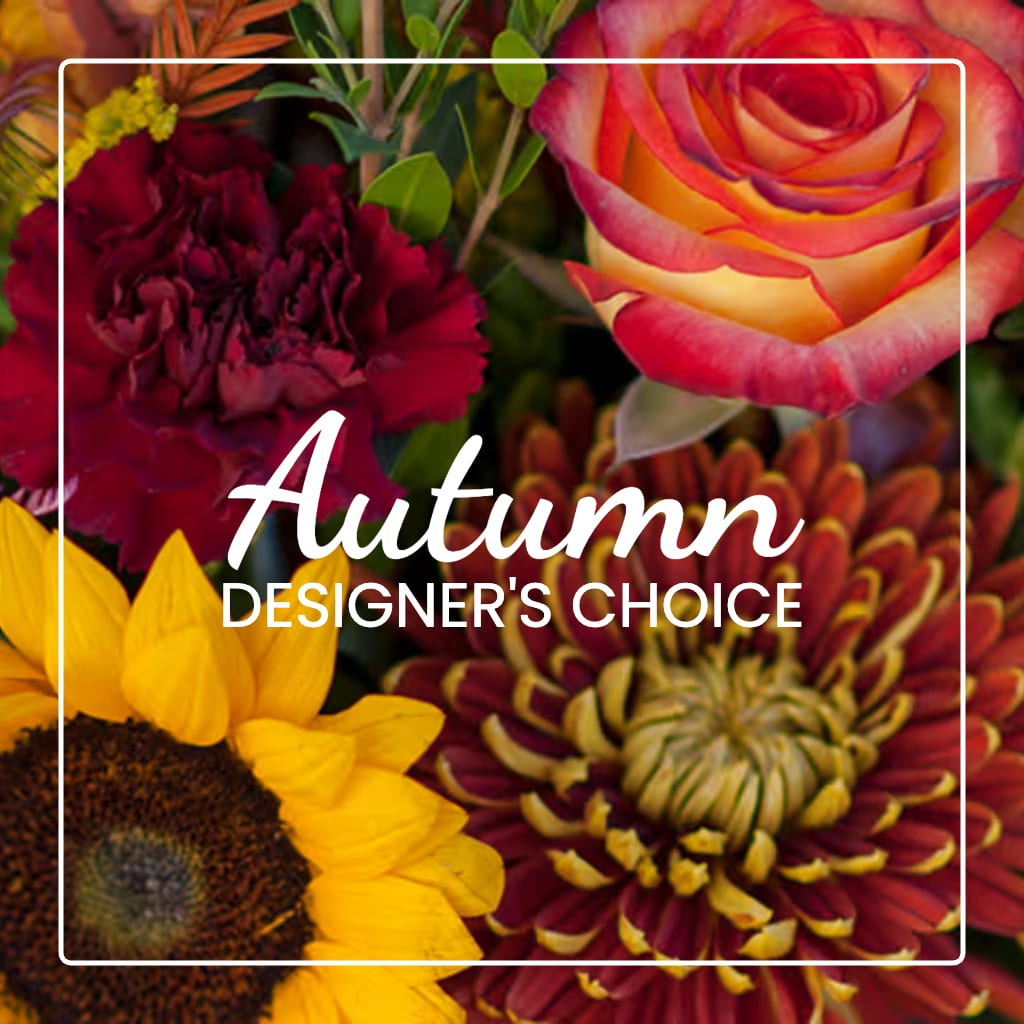 Autumn floral design with a rose, carnation, sunflower, and chrysanthemum