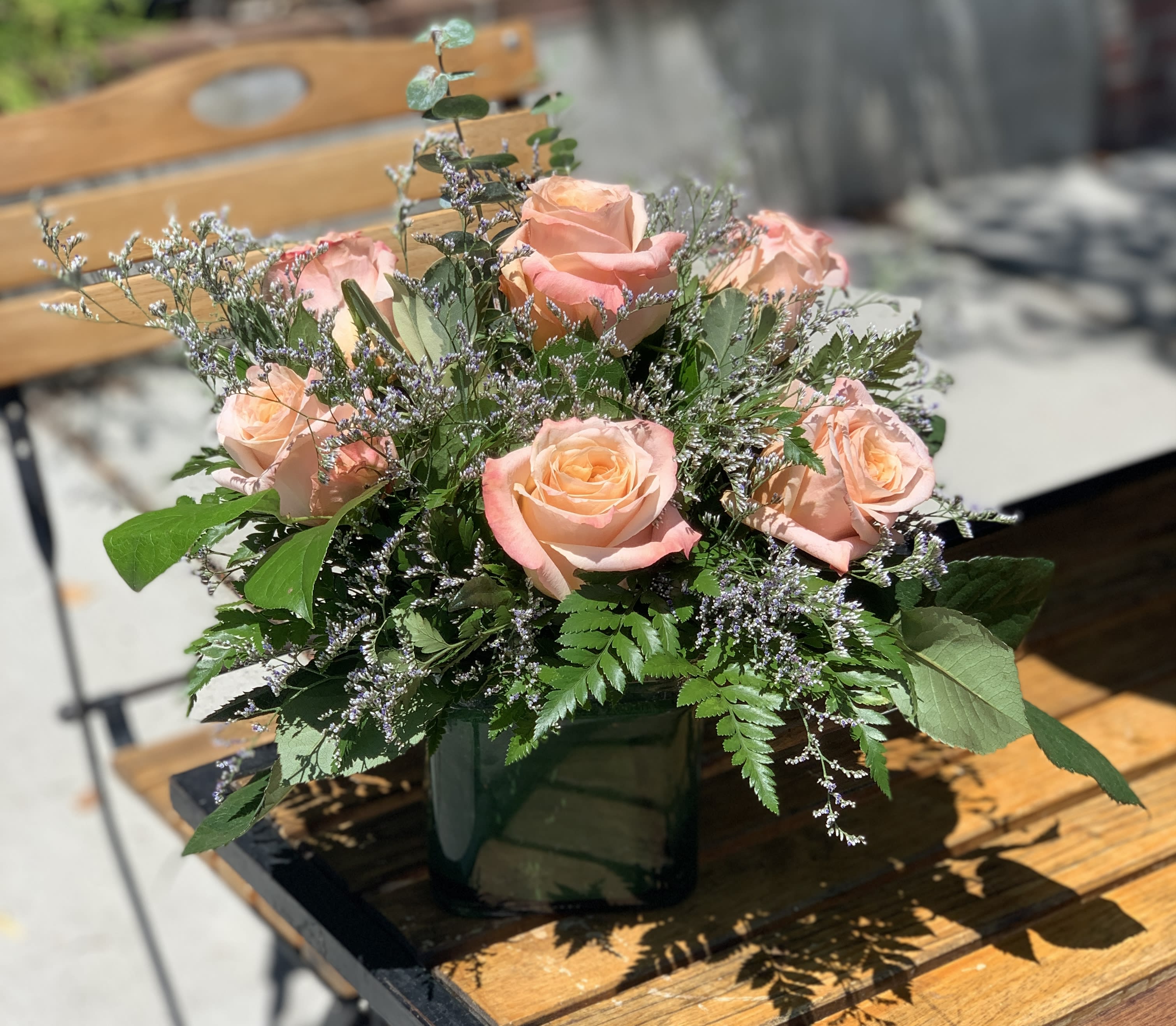 Summer Shimmers  - This bouquet shines with a soft tremulous light. Our fresh shimmer roses are arranged compactly in a vase. 