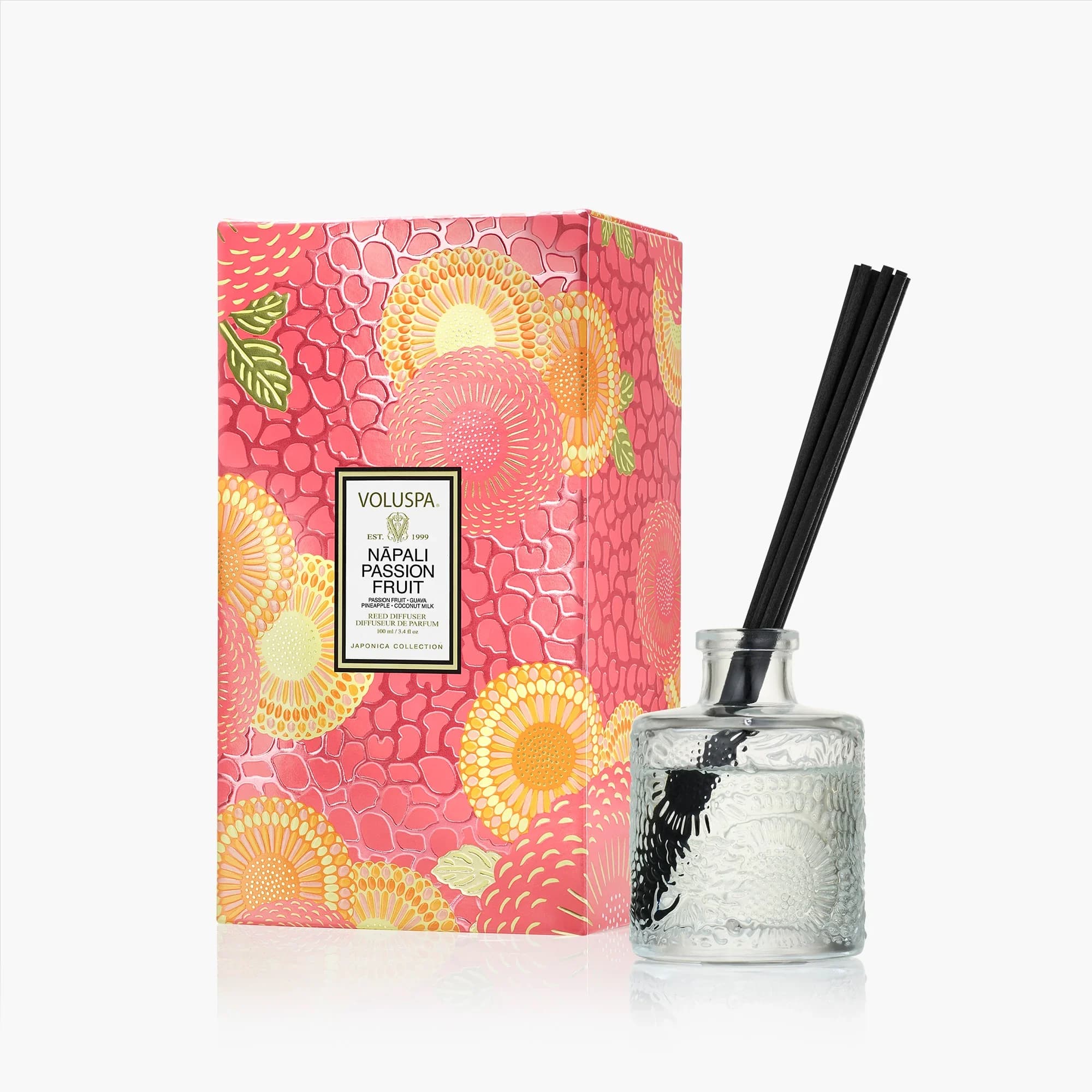 Voluspa Napali Passion Fruit Reed Diffuser - Venture the trail less traveled and escape to the edge of paradise with a lush array of tropical fruits designed to pique every sense. A slow inhale of sunlit passion fruit, juicy guava, and chilled pineapple tempts the palate, unfolding into a decadent swirl of creamy coconut milk and smooth vanilla bean. A canopy of exotic fruits....rest where the wild grows sweet.