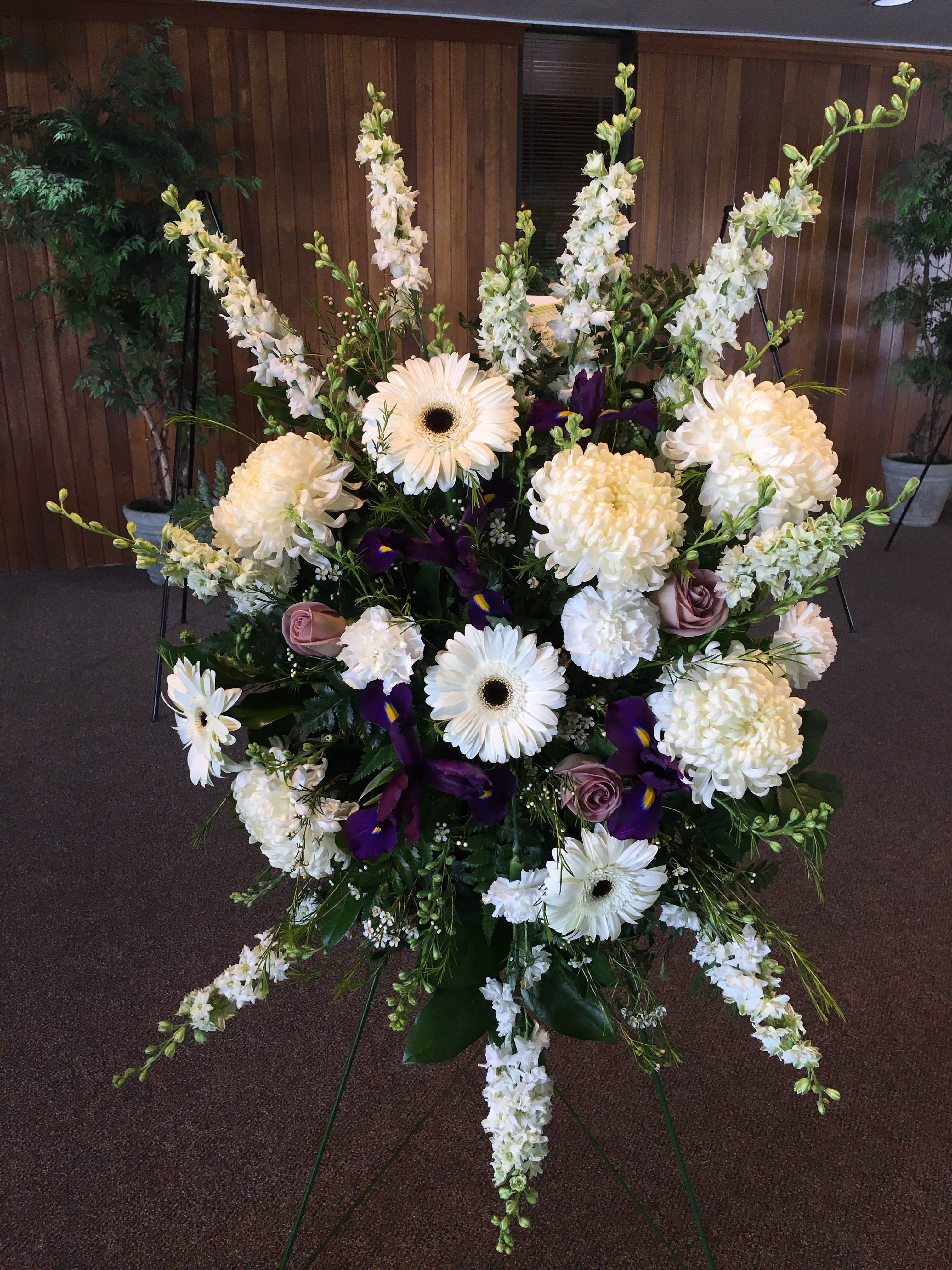 Medium Sympathy Spray with Gerber Daisies - color may vary - Medium size spray of flowers on an easel. This makes a great size for most churches and halls. Selection and color WILL vary.  You can select the colors when you order at least 5 days prior. Place your color choices in the comments section.