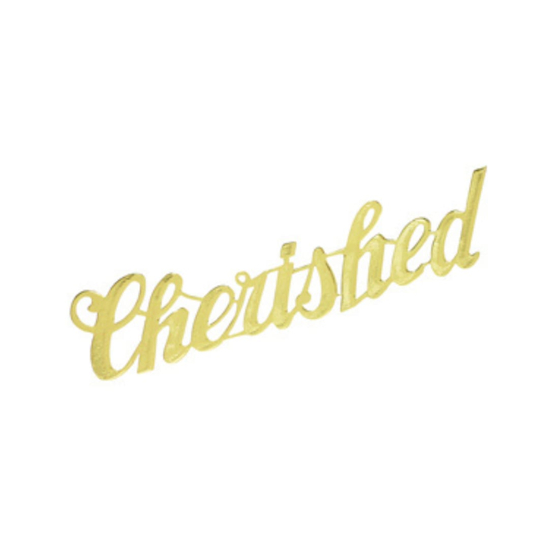 Gold script "Cherished" decoration on a white background