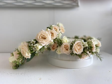 Cream rose floral crown on a white round box