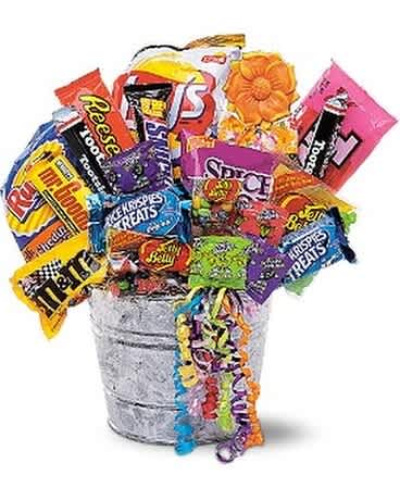 Bucket filled with assorted candy bars and colorful streamers