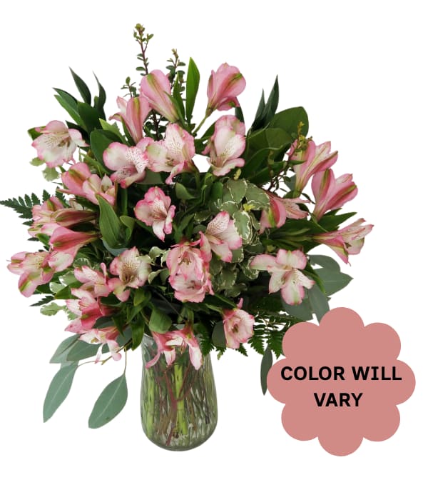Pink alstroemeria bouquet in a glass vase with a color-will-vary note