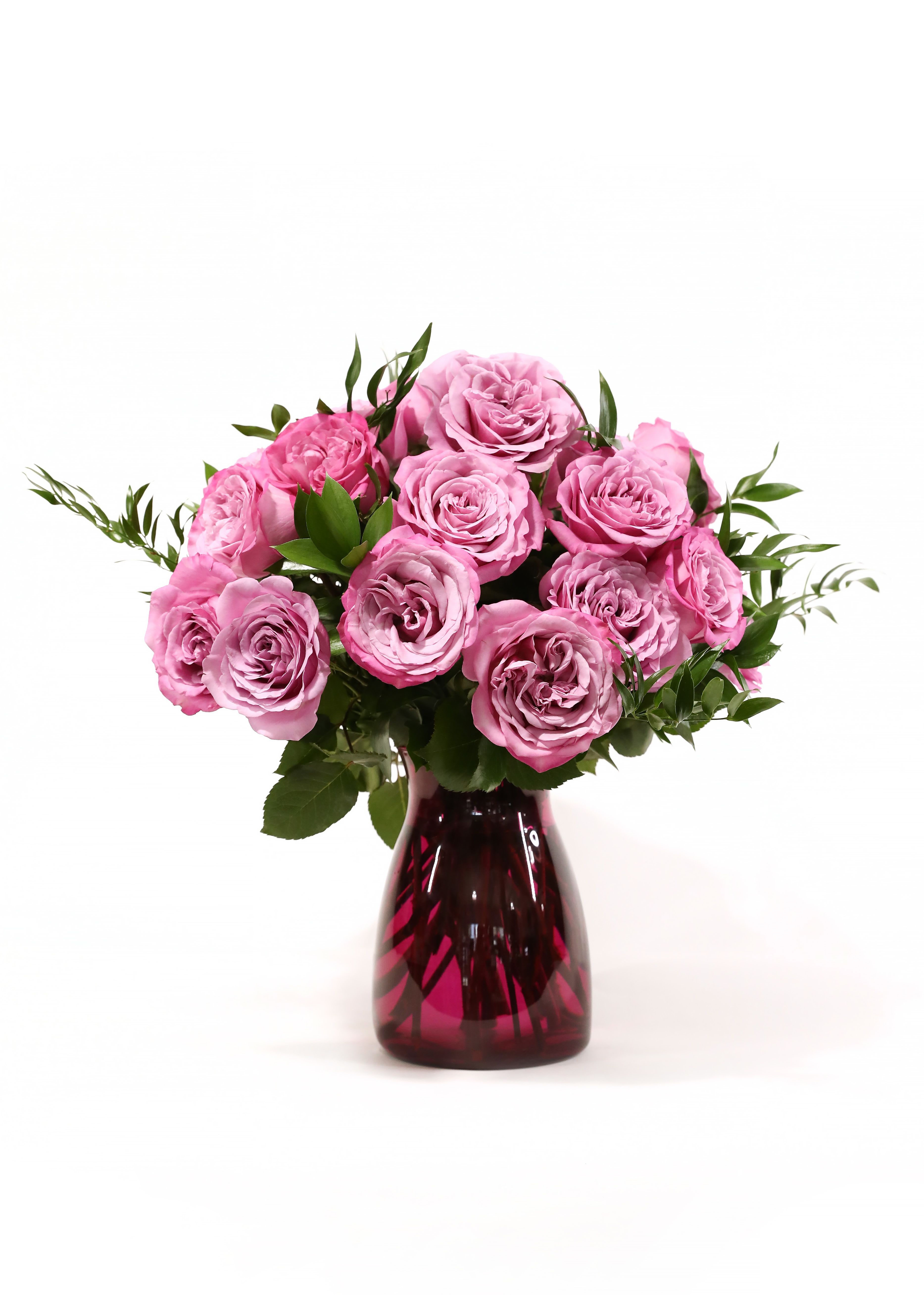 GARDEN ROSES - A DOSEN PINK GARDEN ROSES IN A PINK VASE.