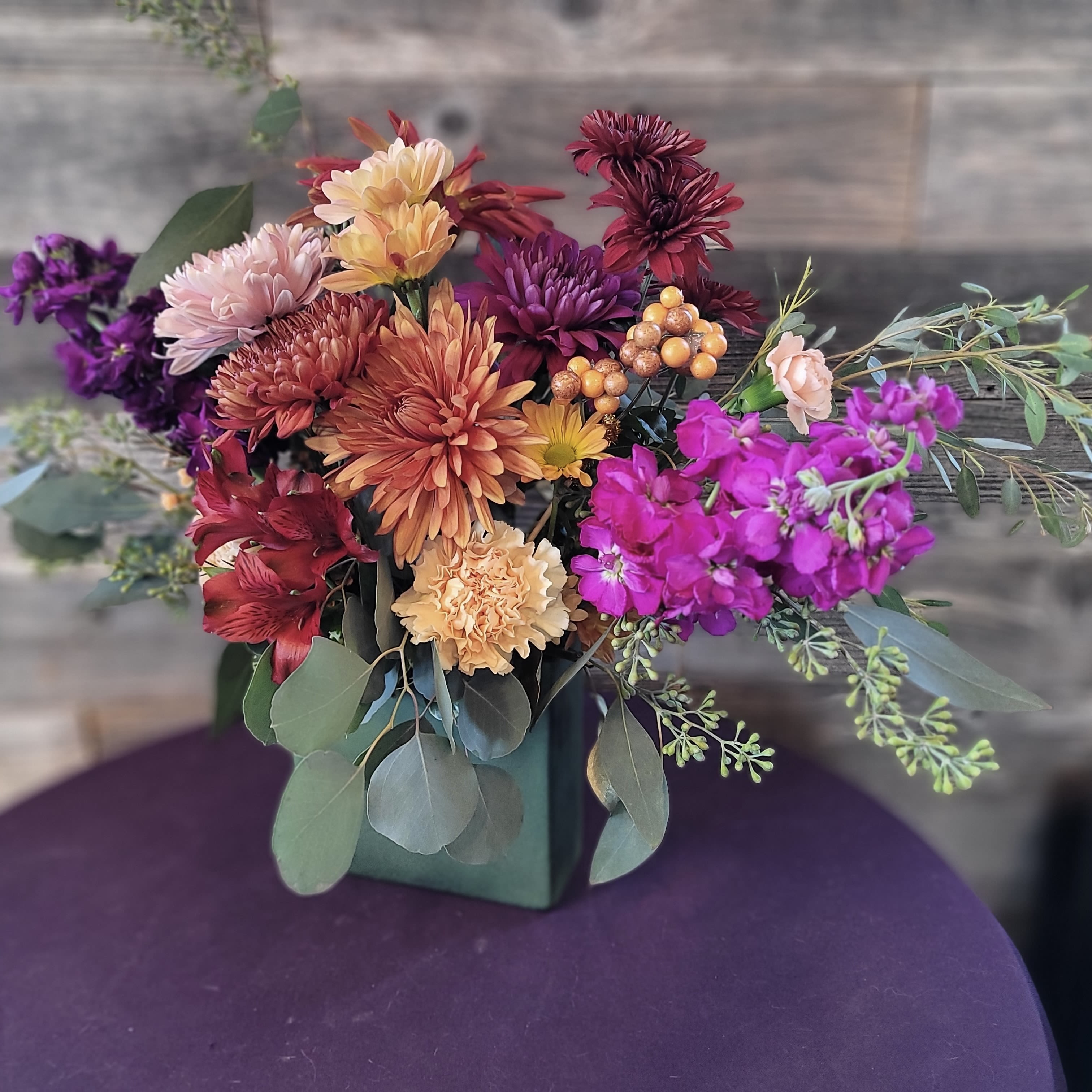 Fall is Here - Many different flowers remind us that Fall has arrived! Mums, carnations, alstroemeria, fragrant stock, plus some showy greenery. 