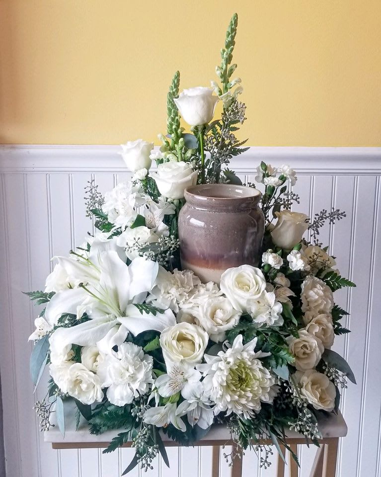 Tranquil Thoughts Funeral Urn Arrangement - A classic arrangement featuring whites and greens reflects a spirit of peace and serenity. A lovely tribute for a cremation urn. (Urn not included) Approx dimensions 23in x 18in 