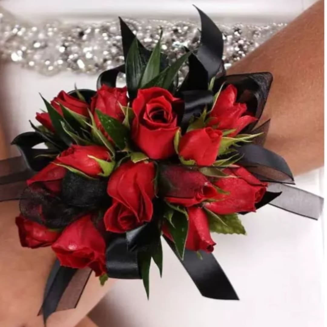 Red rose wrist corsage with black ribbon accents