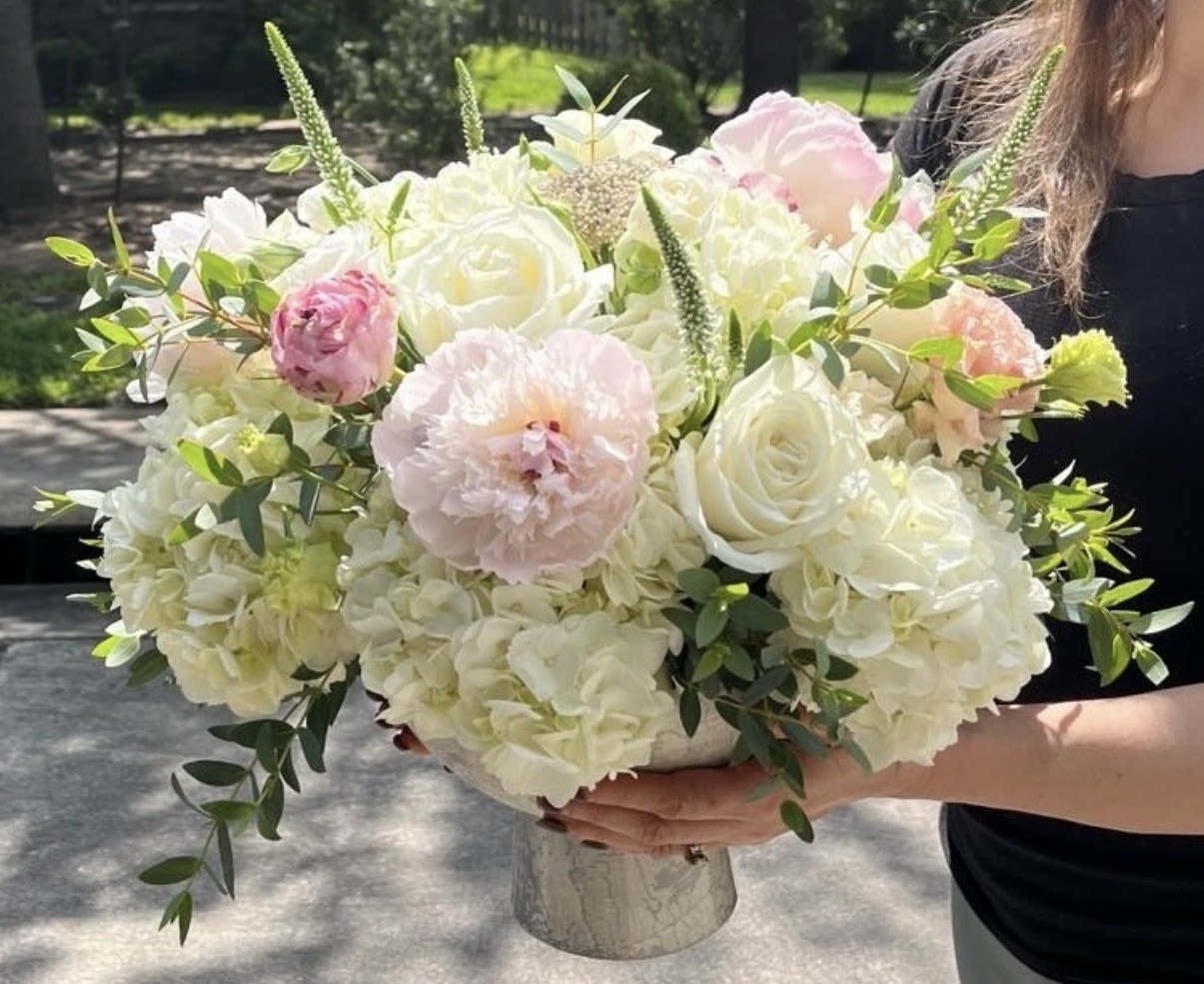 Large bouquet of white and blush flowers in a vase
