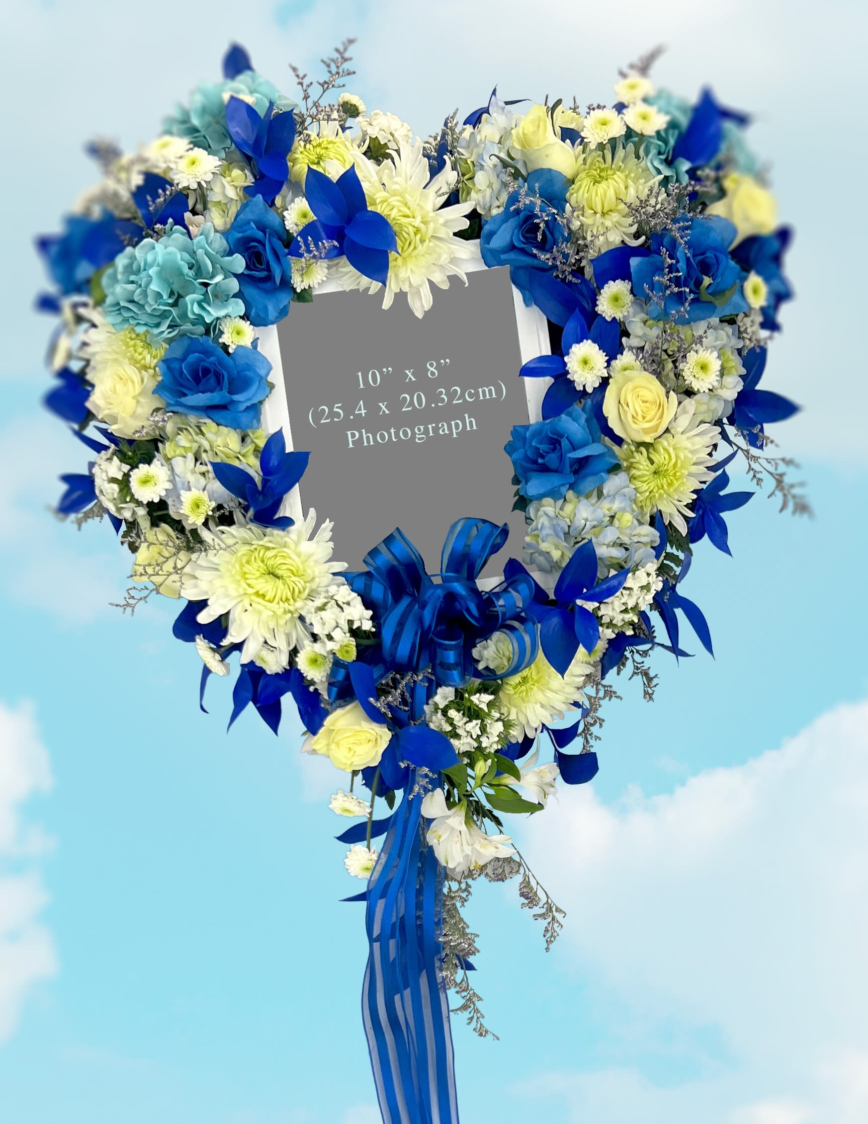 Heart-shaped floral wreath with blue and white flowers and ribbon