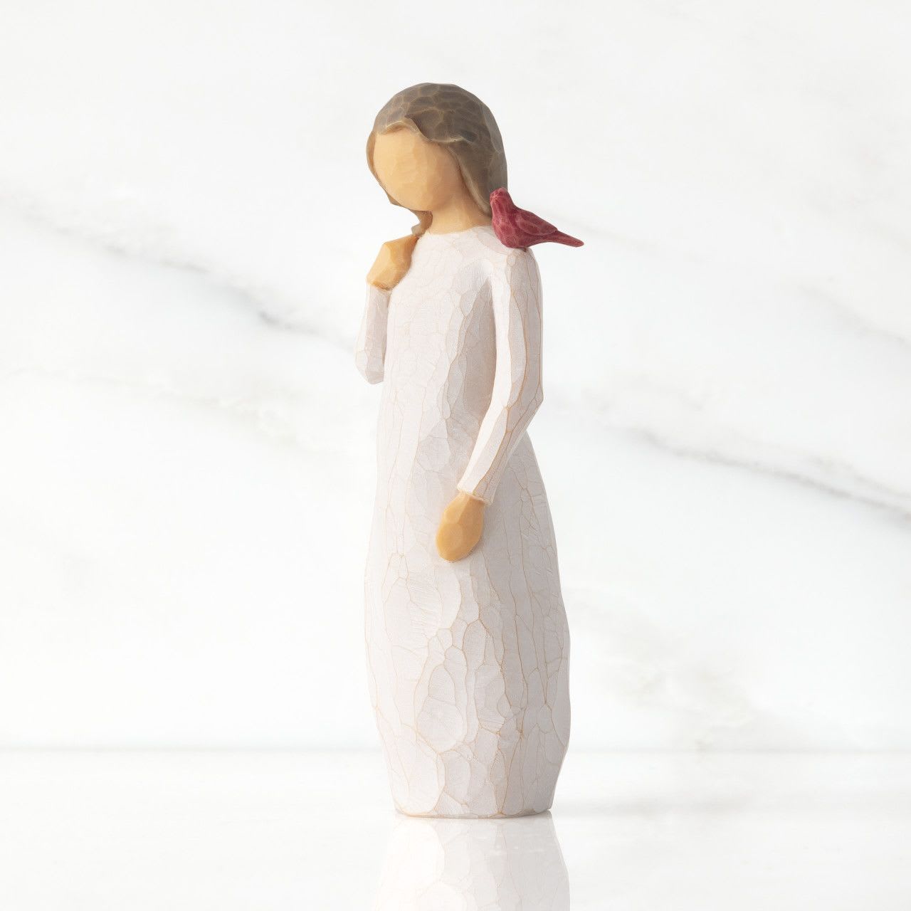 Messenger - A gift of comfort and healing for one who has lost, or is very far from, a loved one. A reminder that those we love are always with us, in our memories and in our hearts. A red cardinal visits this figure as a small uplifting symbol of remembrance.