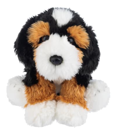 Plush dog toy with black, white, and tan fur