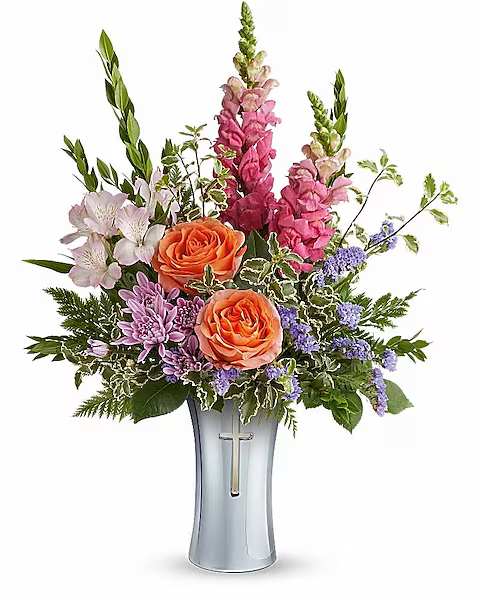 Mixed bouquet in a silver vase with orange roses and pink flowers