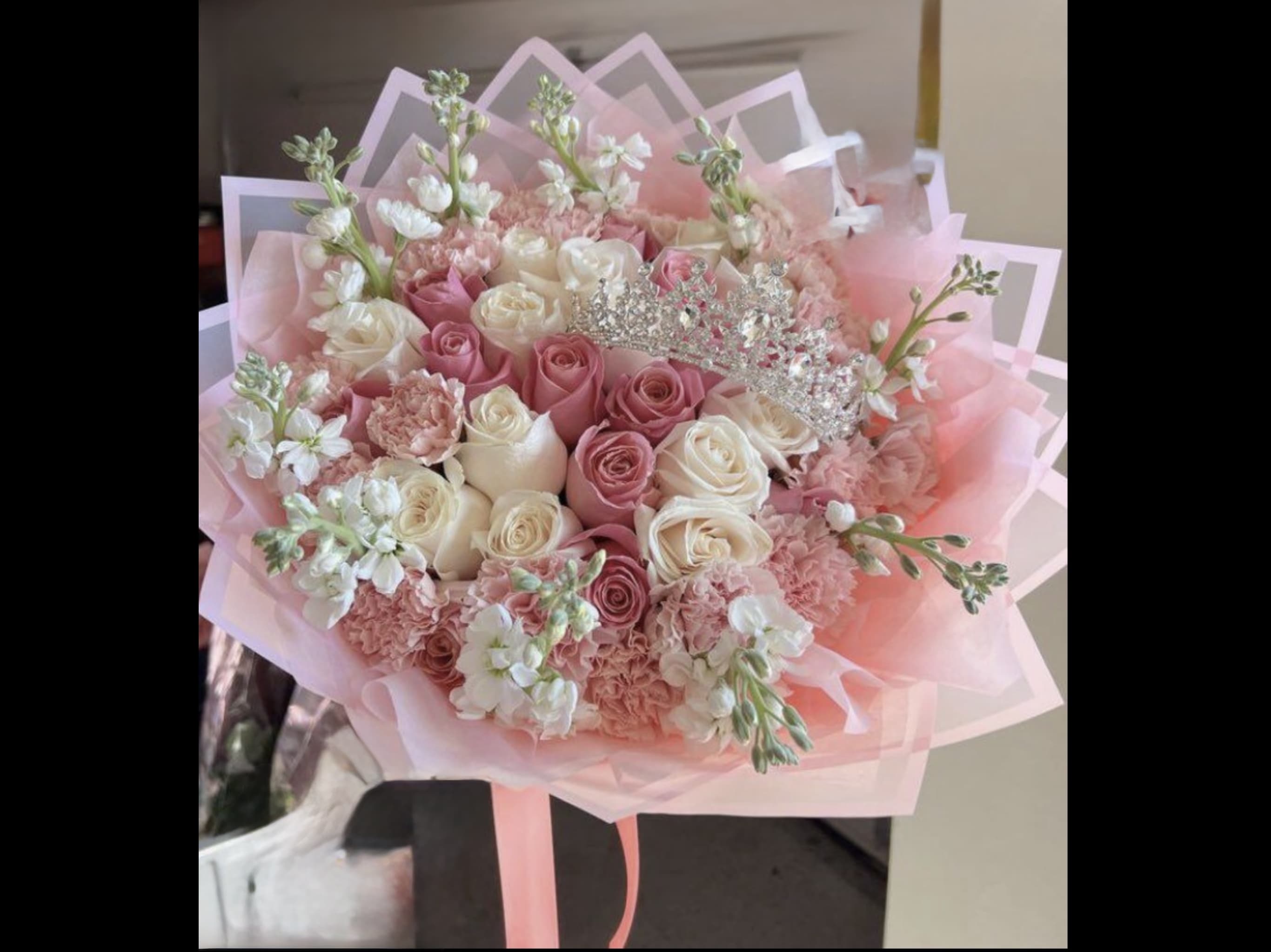 Princesses  - A bouquet of soft colors with a fresh design, wrapped in paper that complements the colors, creating a lovely feeling for the person who receives it. The bouquet includes a tiara, making it even more special and elegant. (Standard 15stems of roses , carnations ,stock,Deluxe 25 stems of roses ,carnations,stock,Premium 30 stems of roses ,carnations,stock)