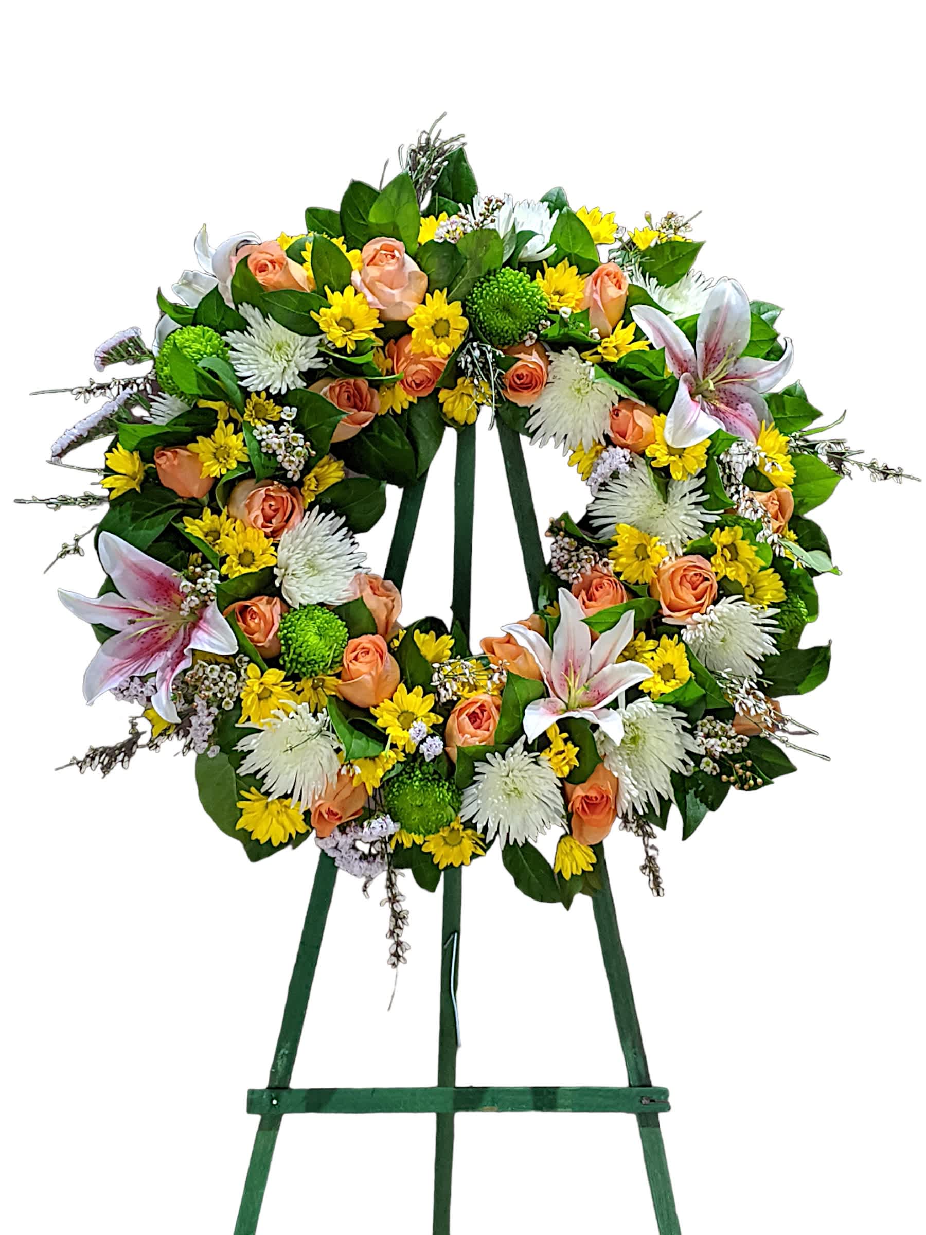 Forever Remembered Wreath - Pink lilies, orange roses, and a mix of  green, yellow, and white chrysanthemums. This wreath of lighter beautiful melody of flowers is a beautiful option to show your affection towards a recently deceased loved one. This type of design is usually approximately 5 - 6 ft tall and is meant for funeral services ONLY. This design includes a free banner (please include a banner sign in the Special Instruction Box or Message Box with the title “BANNER”).  In the event a banner space is left blank for any reason, ONLY a card message will be included. Banners are printed in a black 2.5-inch wide ribbon with silver ink. Currently, we don't offer any other colors. If the service is the same day as the order was placed we cannot guarantee delivery by a certain time. And flowers will be delivered during normal business hours.  To ensure the delivered flowers match the displayed photo as close as possible we recommend ordering 3-5 days in advance. For the same or next day deliveries, we reserve a right to substitute flowers with the same or greater value.