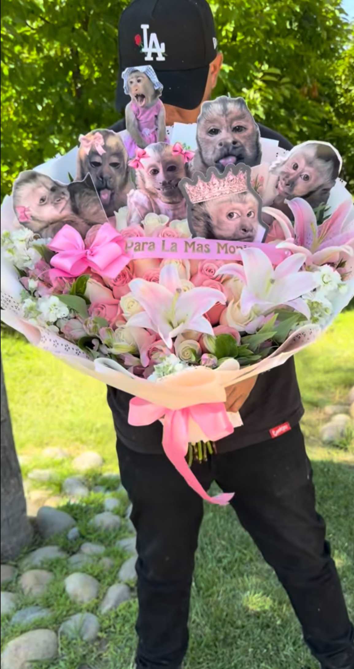Pink bouquet with lilies, roses, and monkey cutouts
