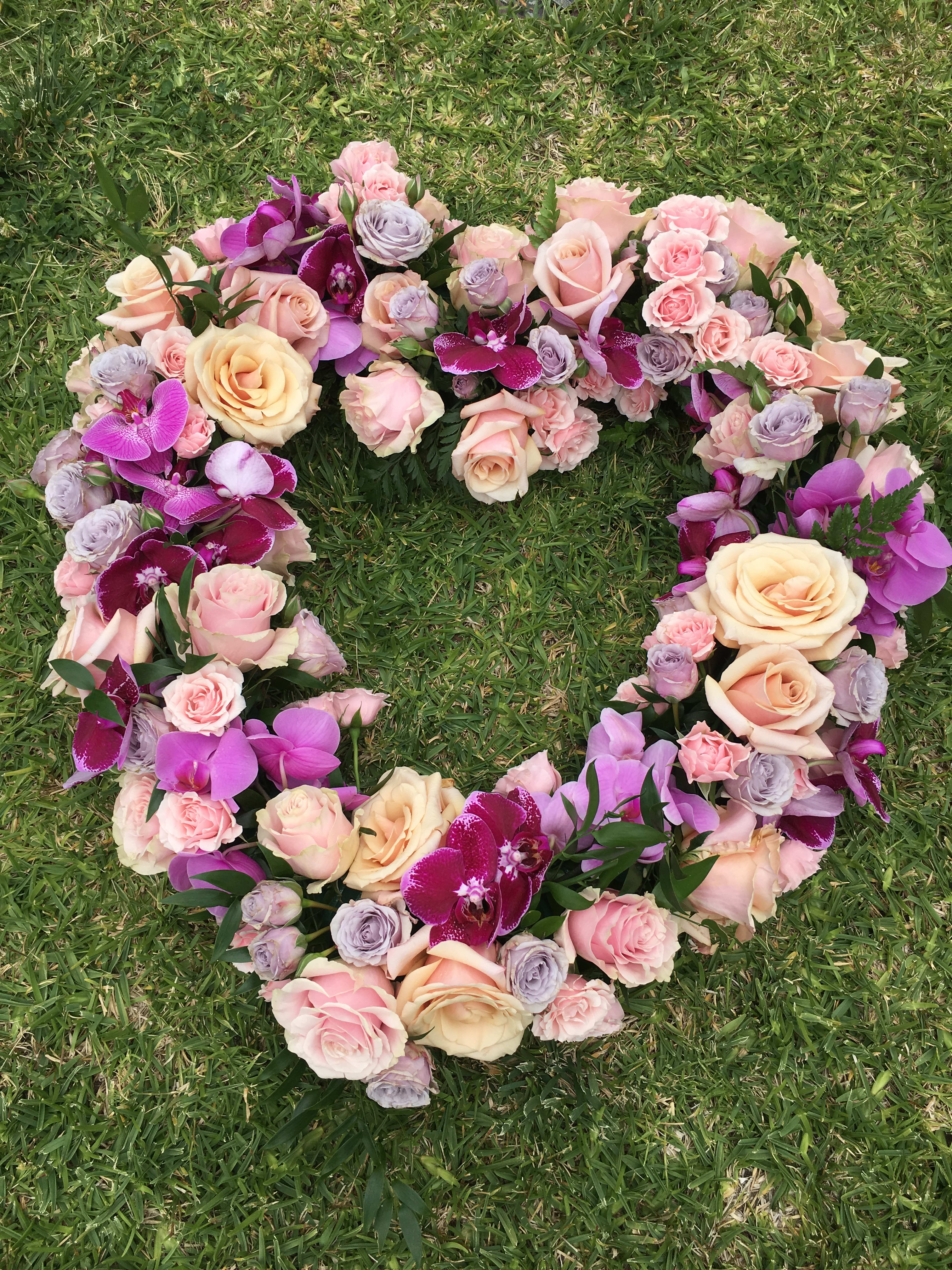 Miss You - Open heart with orchids &amp; roses this beautiful open heart can be made with colors of your choice we can also personalize a banner.  this is a beautiful tribute arrangement for a funeral sympathy services or memorial. funeral flowers sympathy flowers missing you flowers 