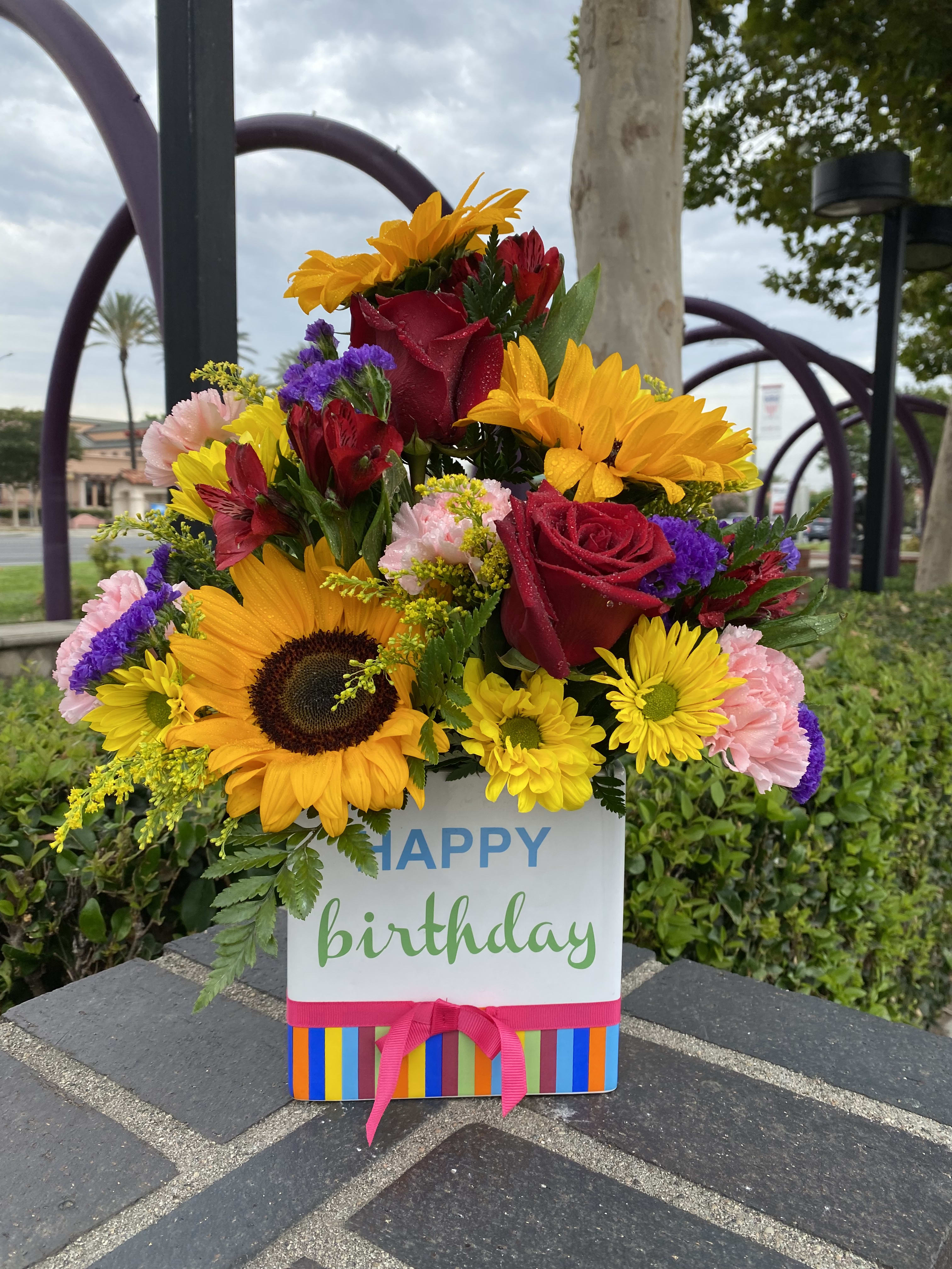 Birthday Blooms  - Happy birthday keepsake container and beautiful flower arrangement consisting of in season flowers