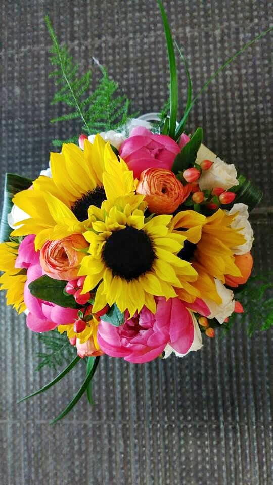 Bright bouquet with sunflowers, pink blooms, and orange flowers
