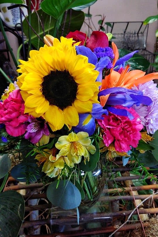 Bright mixed bouquet with a large sunflower and colorful blooms