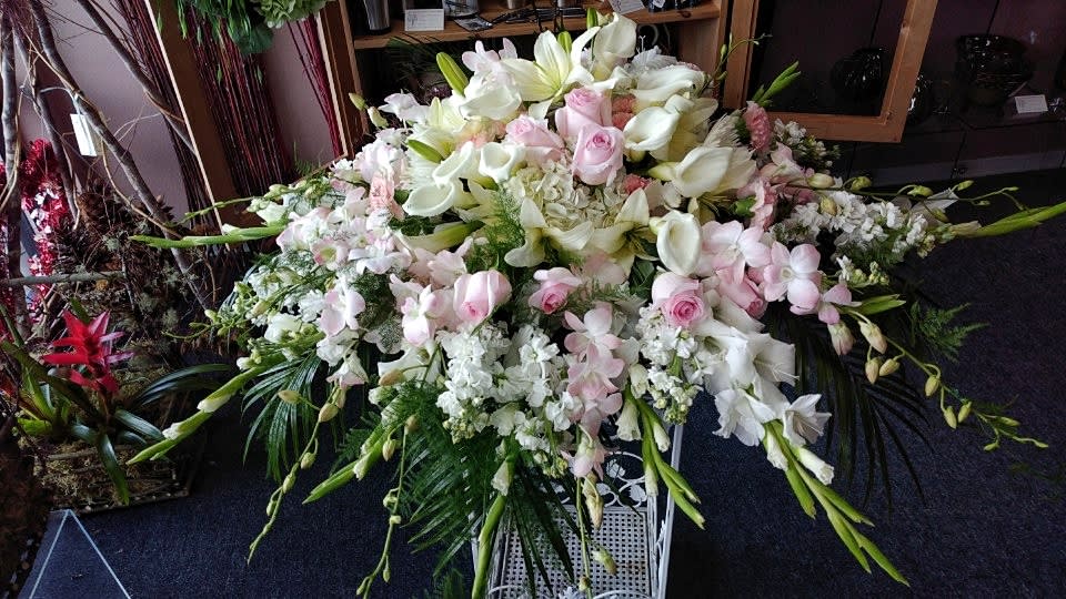 Large white and pale pink floral spray with lilies and roses