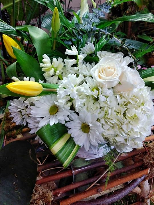 White bouquet with roses, daisies, and yellow tulips
