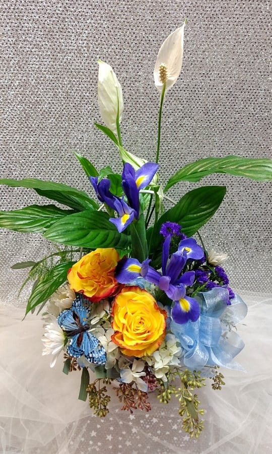 Bouquet with yellow roses, purple irises, and white peace lilies