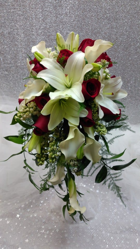 Bouquet of white lilies, red roses, and white calla lilies