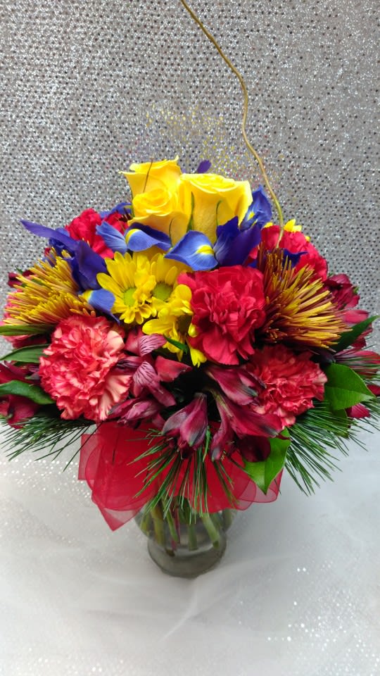 Colorful bouquet of mixed flowers in a glass vase