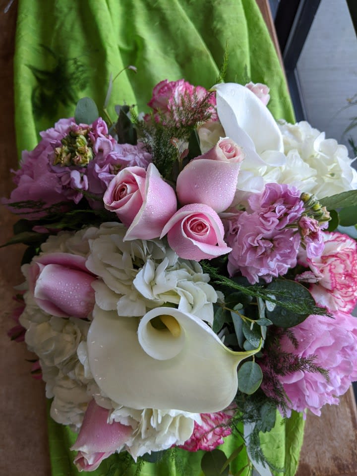 Sweet Thoughts - A lovely pastel theme arrangement, designed beautifully with roses, calla lilies, peonies, stock, hydrangea, and filler greens in a bubble bowl. Dimension: 12"x12"